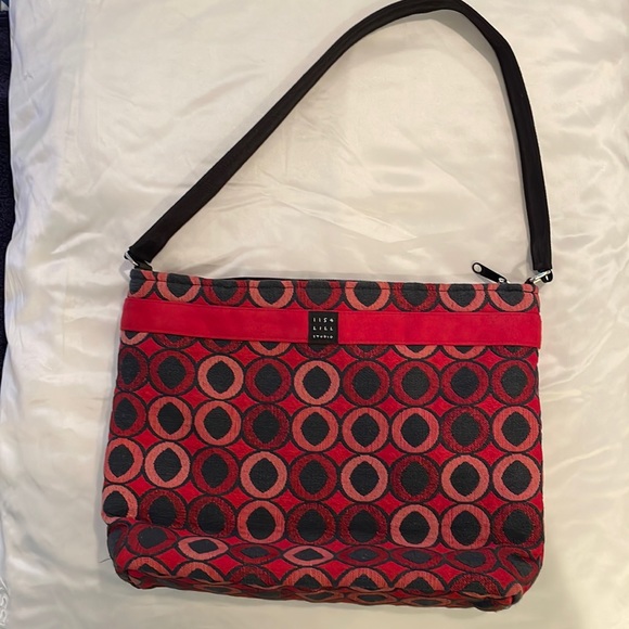 1154 Lill Studio. Cute fabric purse in red and black with shades of red. - Picture 1 of 3